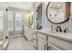 Bathroom boasts dual sinks, marble counters, and a shower at 8890 S Quatar Ct, Aurora, CO 80016