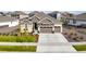 Charming single-Gathering home with a manicured lawn, three-car garage and inviting entrance at 8890 S Quatar Ct, Aurora, CO 80016