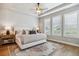 Main bedroom showcases a tray ceiling, plantation shutters and a designer rug on the hardwood floors at 8890 S Quatar Ct, Aurora, CO 80016