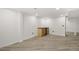 Basement bar area with wood cabinets and wine cooler at 190 W 1St Ave, Broomfield, CO 80020