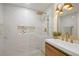 Spa-like bathroom with marble tile and gold accents at 190 W 1St Ave, Broomfield, CO 80020