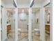 Double vanity bathroom with marble tile and glass shower at 190 W 1St Ave, Broomfield, CO 80020