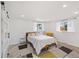 Spacious bedroom with sliding barn door and window at 190 W 1St Ave, Broomfield, CO 80020