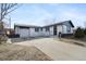 Newly renovated ranch home with modern exterior and attached garage at 190 W 1St Ave, Broomfield, CO 80020