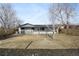 Rear view of a ranch house with a large backyard at 190 W 1St Ave, Broomfield, CO 80020