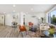 Spacious living room with light beige couch, wood coffee table, and large window at 190 W 1St Ave, Broomfield, CO 80020