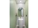 Modern powder room with pedestal sink and brass fixtures at 190 W 1St Ave, Broomfield, CO 80020