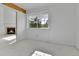 Bright bedroom with a window view, fireplace, and neutral carpet at 31819 Rocky Village Dr # 418, Evergreen, CO 80439