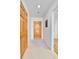 Bright hallway with a wood door, closet, and access to other rooms at 31819 Rocky Village Dr # 418, Evergreen, CO 80439