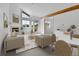 Bright living room featuring vaulted ceiling, fireplace, and balcony access offering scenic views at 31819 Rocky Village Dr # 418, Evergreen, CO 80439