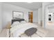 Comfortable bedroom featuring a walk-in closet, a king bed and neutral-toned decor at 31819 Rocky Village Dr # 418, Evergreen, CO 80439