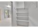 Spacious walk-in closet with a bright window and shelving for storage at 31819 Rocky Village Dr # 418, Evergreen, CO 80439
