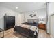 Bedroom with dark wood accents, unique decor, and neutral walls at 7335 E Quincy Ave # 107, Denver, CO 80237