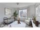 Bedroom with a large window and hardwood floors showcases a light and airy feel at 2550 Winding River Dr # F2, Broomfield, CO 80023