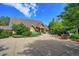 Exterior shot of the community clubhouse surrounded by lush landscaping at 2550 Winding River Dr # F2, Broomfield, CO 80023