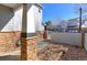 Inviting entrance with stone pillars and landscaped gravel bed at 2550 Winding River Dr # F2, Broomfield, CO 80023