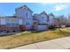 Attractive townhome featuring a well-manicured lawn and neutral siding at 2550 Winding River Dr # F2, Broomfield, CO 80023