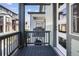 Open balcony with wood flooring and a view of a neighboring property at 1330 Independence St # 2, Lakewood, CO 80215