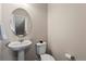 Cozy powder room with pedestal sink and neutral wall color at 1330 Independence St # 2, Lakewood, CO 80215