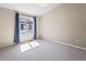 Bright, carpeted bedroom featuring a window with a view at 1330 Independence St # 2, Lakewood, CO 80215