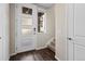 Bright entryway with stylish front door, hardwood floors, and staircase access at 1330 Independence St # 2, Lakewood, CO 80215