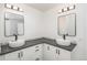 This bathroom features double sinks, modern fixtures, and neutral decor at 14170 W Warren Dr, Lakewood, CO 80228