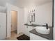 This bathroom features double sinks, modern fixtures, and neutral decor at 14170 W Warren Dr, Lakewood, CO 80228