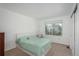 This bedroom features a window view, and neutral carpet at 14170 W Warren Dr, Lakewood, CO 80228
