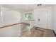 Inviting foyer with wood-look floors, offering a glimpse into the home's bright and airy living spaces at 14170 W Warren Dr, Lakewood, CO 80228
