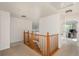 This hallway features wood railings at 14170 W Warren Dr, Lakewood, CO 80228