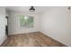Bright living room with hard surface floors and natural light, offering versatility for furniture arrangement and decor at 14170 W Warren Dr, Lakewood, CO 80228