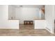 Open-concept living room with hard surface floors, connecting to the entryway, creating a welcoming and spacious atmosphere at 14170 W Warren Dr, Lakewood, CO 80228
