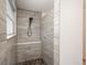 This bathroom features a new, tiled shower with bench seat at 14170 W Warren Dr, Lakewood, CO 80228