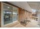 View of patio, sliding glass doors, and a partially snow-covered backyard at 383 S Vaughn Way, Aurora, CO 80012