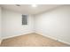 Empty basement bedroom with carpet and window at 383 S Vaughn Way, Aurora, CO 80012