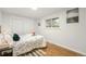 Bright bedroom with hardwood floors and double door closet at 383 S Vaughn Way, Aurora, CO 80012