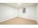 Bright and airy carpeted bedroom with neutral walls and an egress window at 383 S Vaughn Way, Aurora, CO 80012