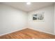 Empty bedroom with hardwood floors and window at 383 S Vaughn Way, Aurora, CO 80012