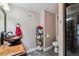 Cozy bathroom featuring tiled floors, vanity with stylish sink, and convenient shelving for storage at 6495 E Happy Canyon Rd # 163, Denver, CO 80237