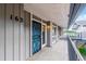 Inviting front entrance featuring a secure storm door and a well-maintained walkway at 6495 E Happy Canyon Rd # 163, Denver, CO 80237