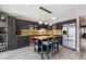 Kitchen with butcher block island, stainless steel appliances, and dark cabinetry, with eat-in breakfast bar at 6495 E Happy Canyon Rd # 163, Denver, CO 80237