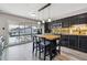 Modern kitchen with a butcher block island, stainless steel appliances, and sliding doors to an outdoor balcony at 6495 E Happy Canyon Rd # 163, Denver, CO 80237
