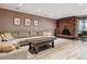 Comfortable living room featuring a classic brick fireplace at 6495 E Happy Canyon Rd # 163, Denver, CO 80237