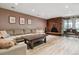 Cozy living room with a brick fireplace and ample seating at 6495 E Happy Canyon Rd # 163, Denver, CO 80237