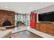 Inviting living area with a brick fireplace and hardwood floors at 6495 E Happy Canyon Rd # 163, Denver, CO 80237