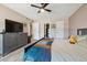 Generous main bedroom, featuring a contemporary aesthetic, ample closet space, and wood-look flooring at 6495 E Happy Canyon Rd # 163, Denver, CO 80237