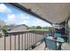 Relaxing patio seating with views of the green space, with chairs and a table at 6495 E Happy Canyon Rd # 163, Denver, CO 80237
