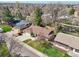 Aerial view showcases the property's beautiful brown roof, mature trees, and well-maintained neighborhood at 2243 S Olive St, Denver, CO 80224