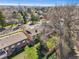 A cozy house featuring a well-maintained yard and mature trees in a quiet residential neighborhood at 2243 S Olive St, Denver, CO 80224