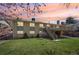 Beautiful backyard features lush green grass and a large deck with stairs, great for outdoor enjoyment at 2243 S Olive St, Denver, CO 80224